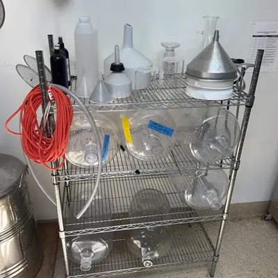 stainless-steel-uline-rack-and-contents-plastic-6-gallon-jugs-glassware-mashers-and-funnels-ms998l3a